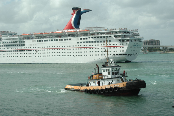 Tugboat with Carnival cruise ship