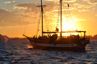 Cabo Legend sailing at sunset